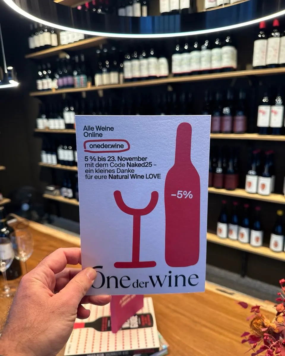 The flyer with the glass and the bottle in the showroom